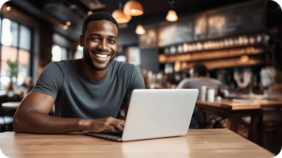 man-sitting-in-cafe-with-laptop