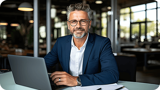 man-sitting-in-office-with-laptop